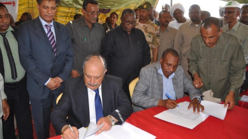 Signing the agreement.Pictured seated are Dr. Mahmoud Solh (Left) and Prof. Ibrahim Adam Eldukheri of ARC. Also pictured are H. E. Minister of Agriculture, Eng. Ibrahim Mahmoud Hamid, and Sudanese Vice-President, H. E. Hassabo Mohamed Abderahman.