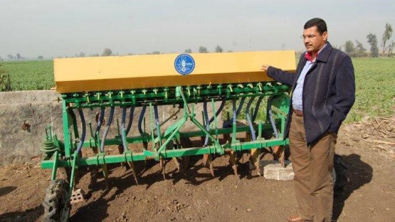 Dr. Atef Swelam with the raised-bed machine.