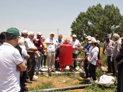 ICARDA scientists training farmers and technicians on how to use the newly-implemented irrigation system